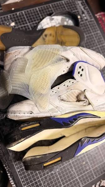 A collector sneaker degrading in storage — crumbling, yellowing foam